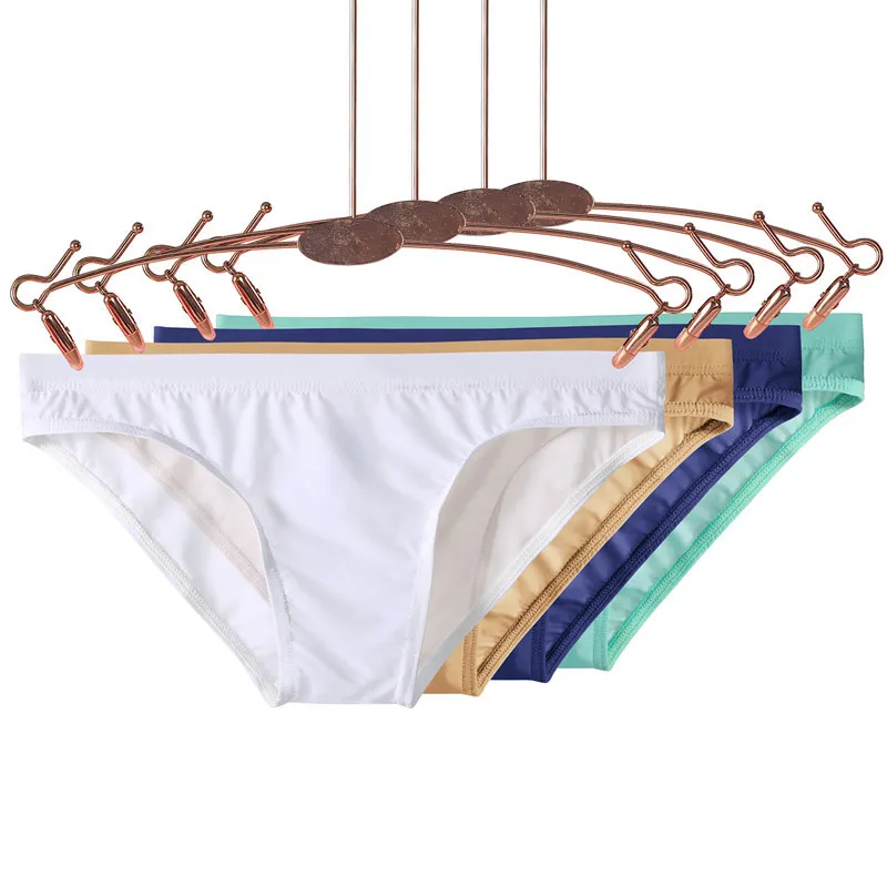 Calzoncillos para hombre, ropa interior para playa, verano, tangas lisas sexis y elegantes, bañadores ajustados a la moda, Bikini suave con bulto