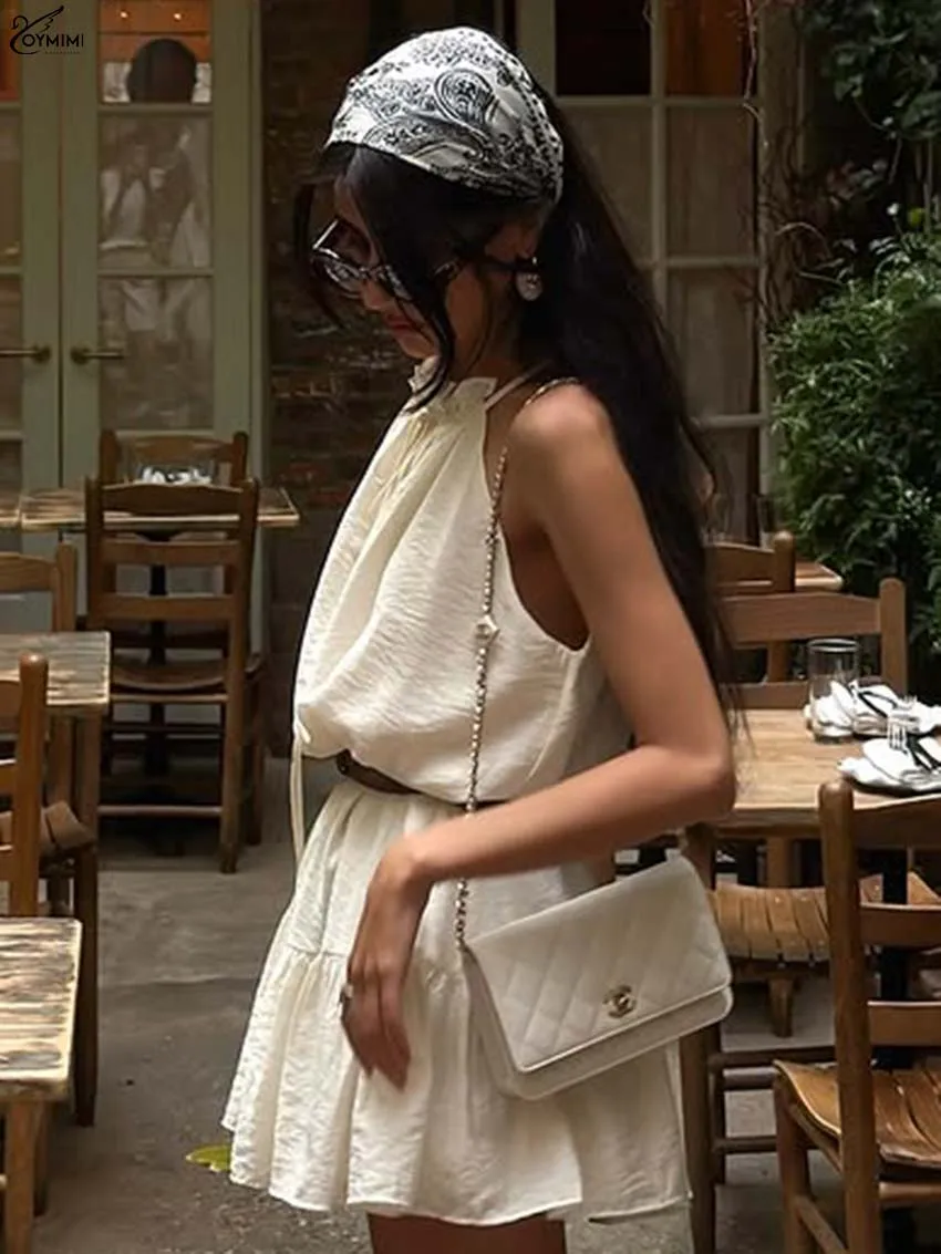 Oymimi Casual Beige Loose Womens Dresses Fashion Lace-Up Sleeveless Open Back Dresses Autumn High Waisted Pleated Mini Dress