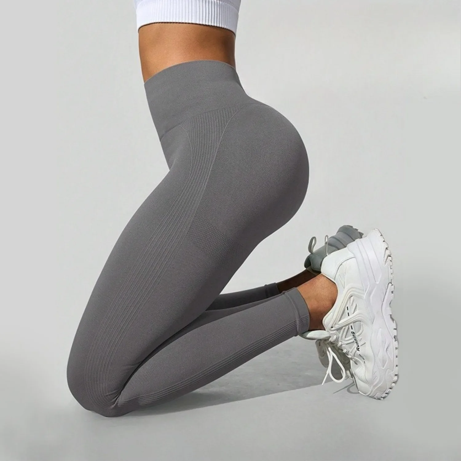 Damskie dzianinowe bezszwowe spodnie do jogi z wysokim stanem, modelujące pośladki, elastyczne, obcisłe legginsy do jogi i fitnessu.