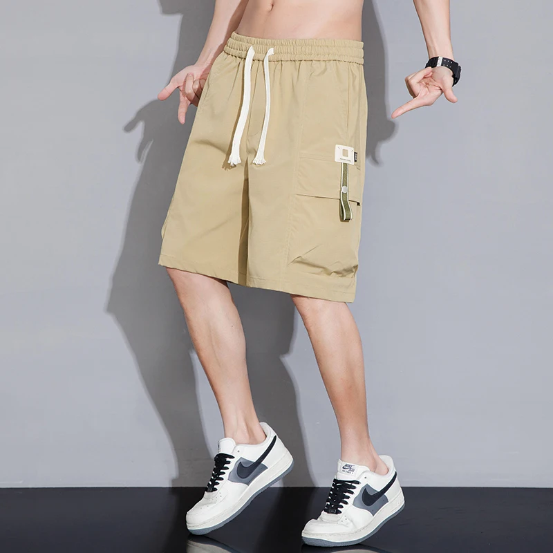 Fashion Elastic Lace Up Spliced Pockets Casual Shorts Men\'s Clothing 2024 Summer New Loose Korean Solid Color Knee Cargo Shorts