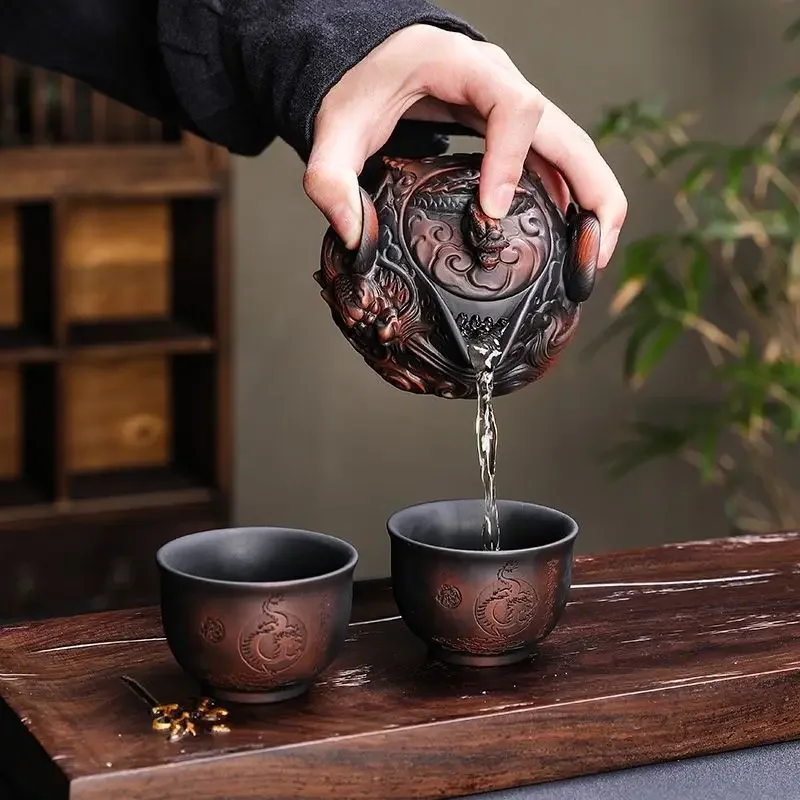 

Chinese Purple Pottery Handmade Pile Carving Flying Dragon Hand Grab Pot Travel Tea Set A Pot Two Cups Kung Fu Tea Set