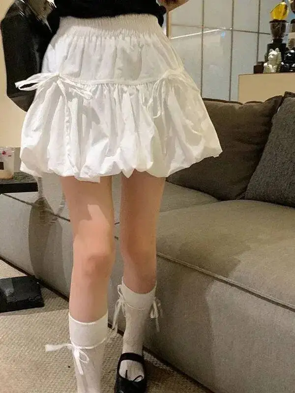 Coréen nœud papillon une ligne jupes femmes été taille haute lanterne Mini jupes femme couleur unie Style doux jupe filles LYS9