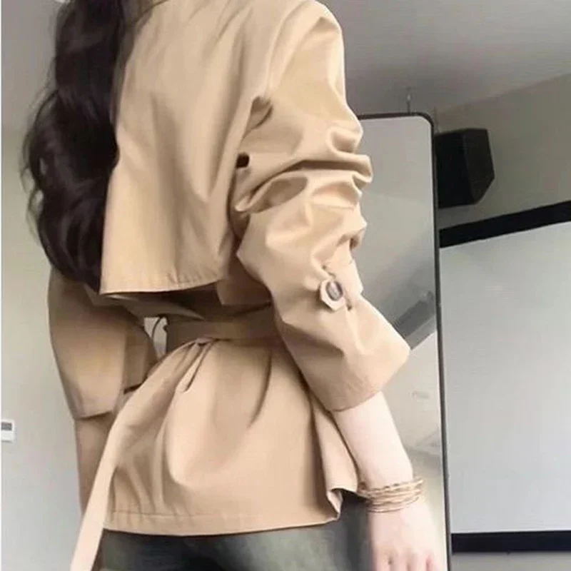 Korean advanced windbreaker women's autumn and winter new fashion temperament waist slim double-breasted lapel long coat.