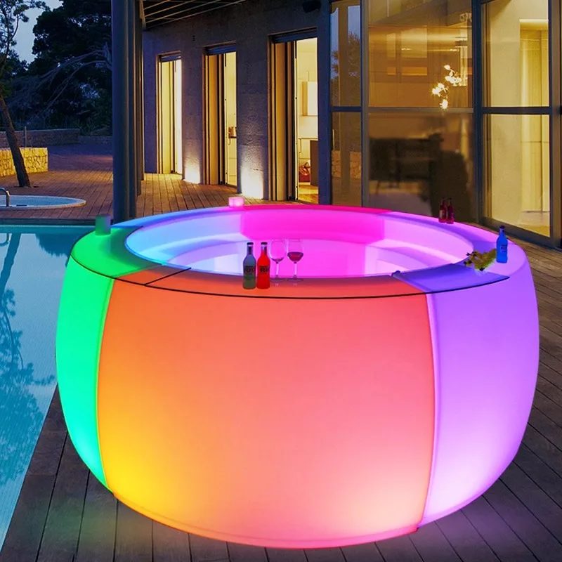 Outdoor luminous round bar can be moved. Commercial waterproof bartending table for party before reception at hotel bar.