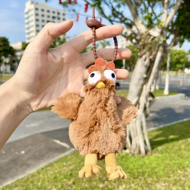 Peluche pulcino che fa l'uovo brutto e carino astratto regalo creativo ciondolo in peluche portachiavi con ciondolo zaino bambola che fa l'uovo