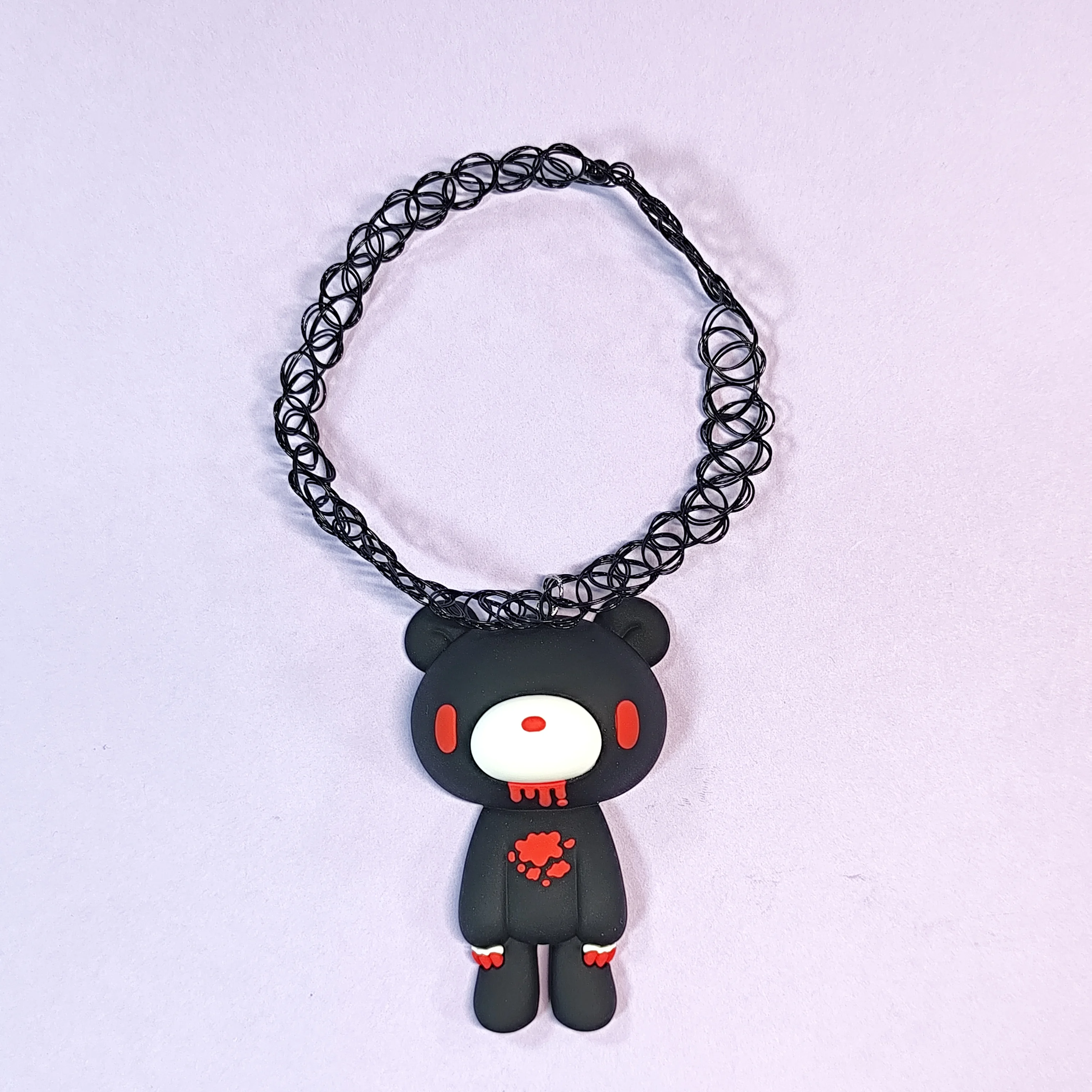 Gothic necklaces with black, bloody - detailed bear pendants on curly chains. Perfect spooky accessories.