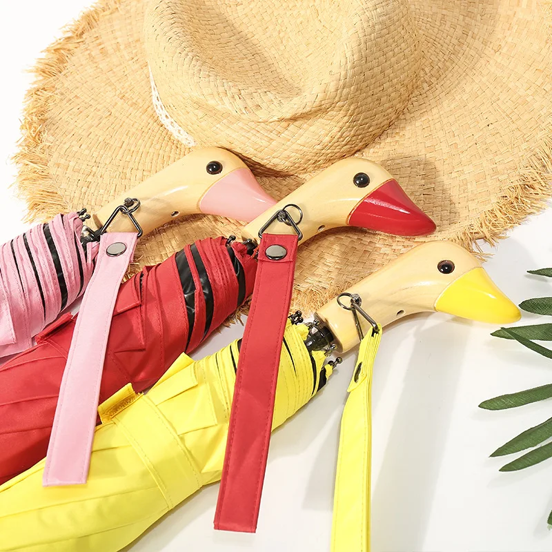 

Cute duck head folding umbrella with wooden handle, sun shading, black rubber, rain and light dual-use, three fold umbrella