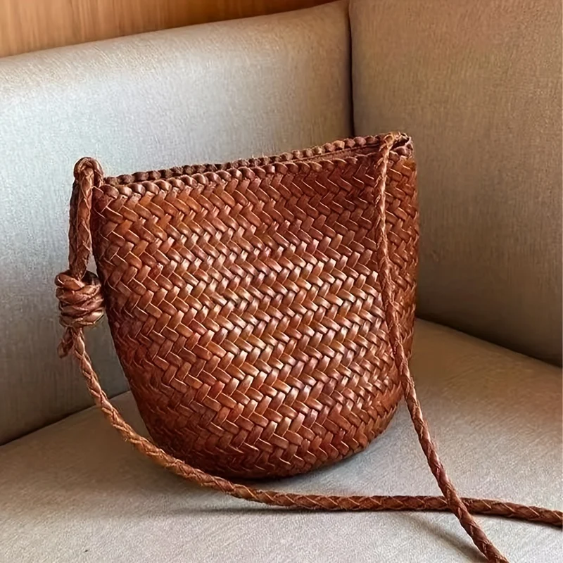 Large woven PU bucket bag in French country dark brown, buckle closure, fixed strap, gold hardware & lining. Versatile for casual to formal, durable spacious daily bag, ideal for travel & shopping. Stylish practical.