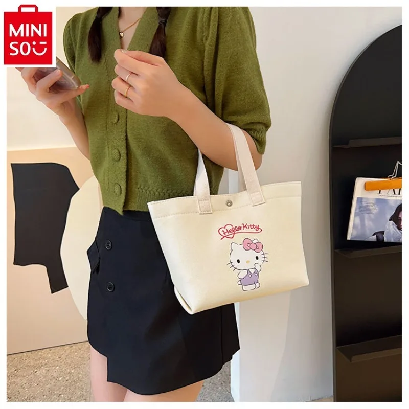 

MINISO Sanrio Cartoon Hello Kitty Kuromi Handheld Canvas Makeup Bag Student Cute Commuting Shoulder Bag