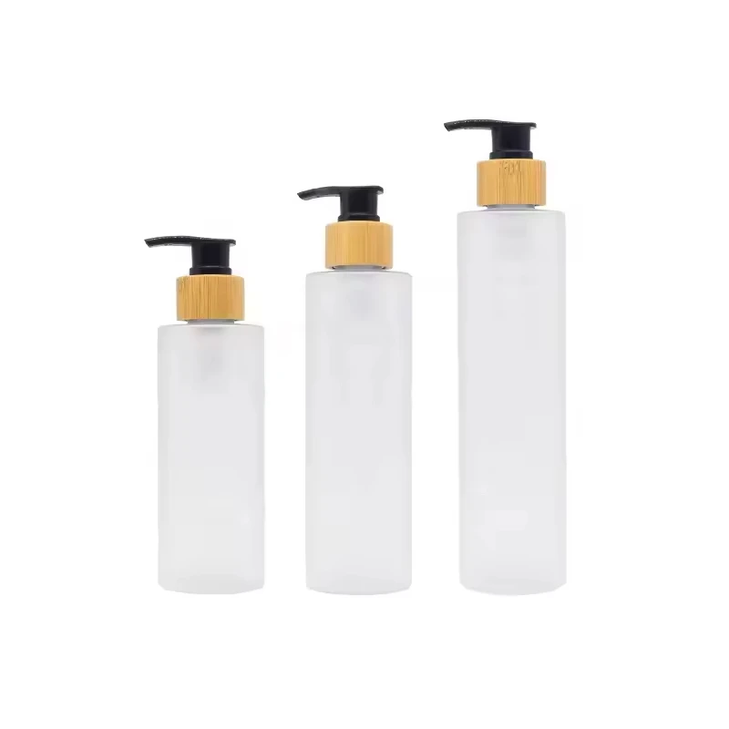 Venda tampa à prova de crianças transparente fosco ombro plano óleo essencial cosméticos garrafa de loção de vidro de bambu, garrafa de vidro de loção doméstica