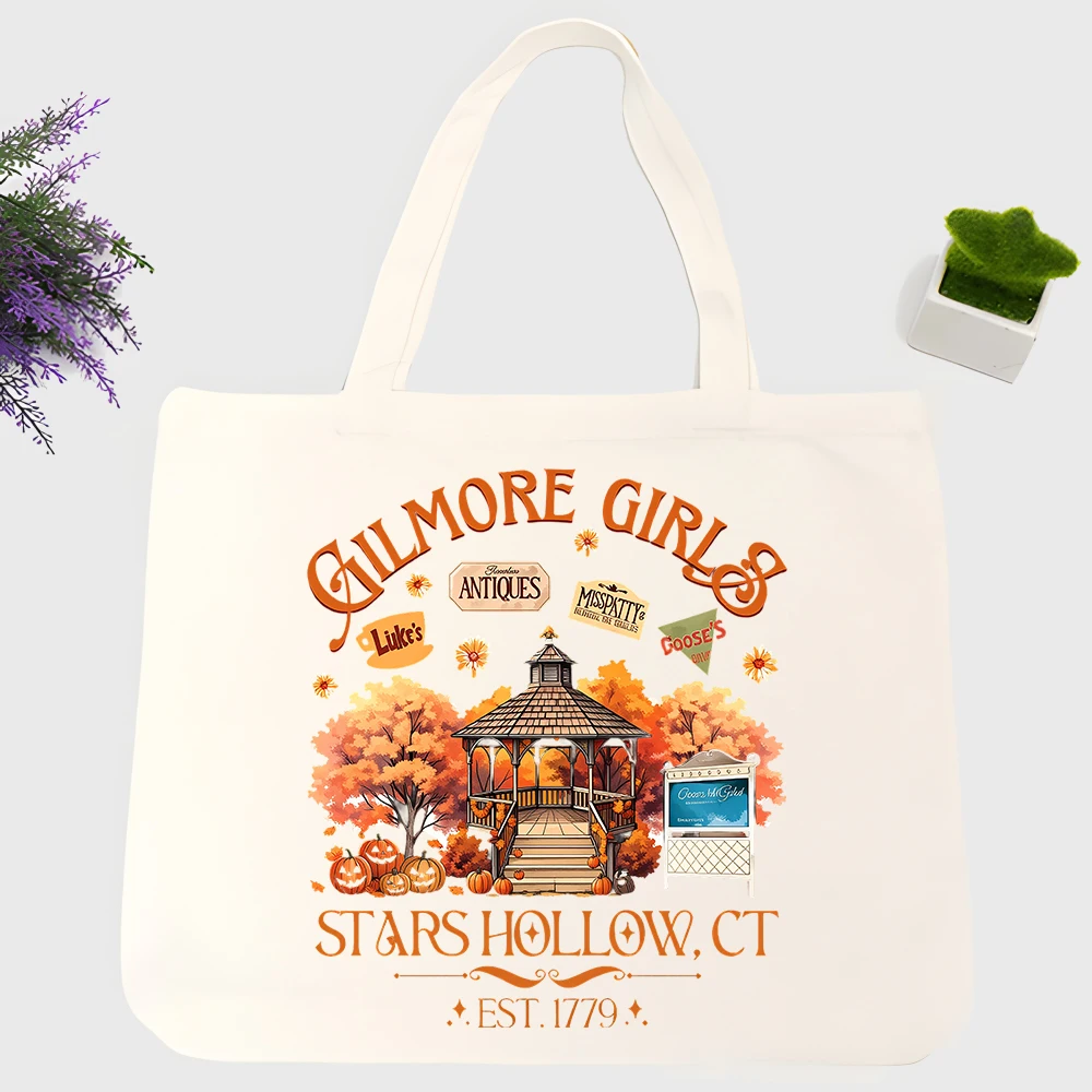 Women's autumn village graphic canvas tote bag with typography print, perfect for casual daily use and fall outings