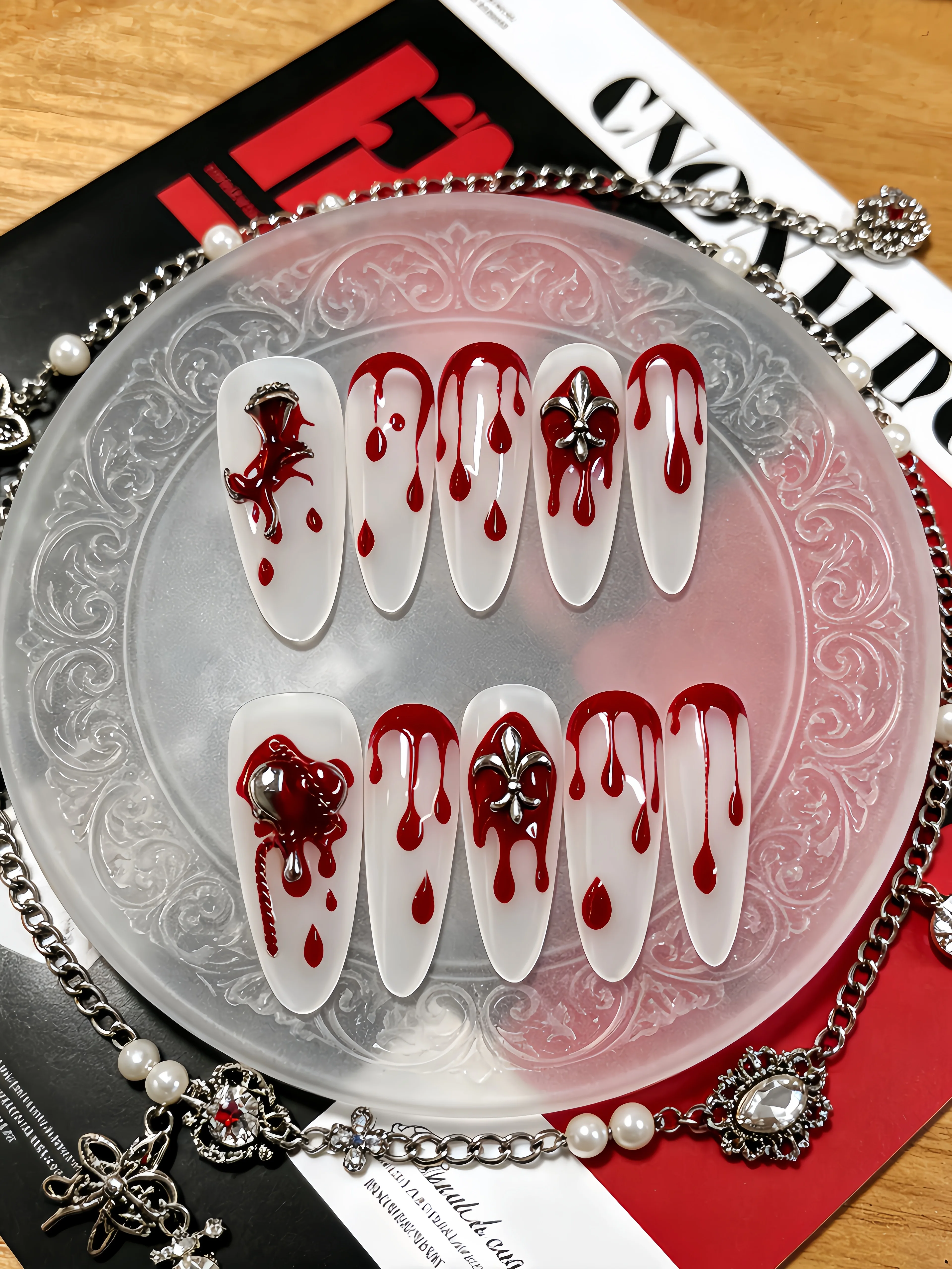 10 Long Waterdrop-Shaped Press-On Nails, with a Milky White Base Color Paired with Red Waterdrop Metal Chain Flower Decorations and Rhinestone Elements, Simple and Stylish Nail Art Patches for Y2K Gothic Style Enthusiasts, Suitable for Daily Use, Work, Office, Bars, Clubbing, Music Festivals, Etc., Punk Style Fake Nails, Suitable for Parties, Swimming, Summer Dates, and Punk Style Nail Art. Includes One Jelly Glue and One Nail File