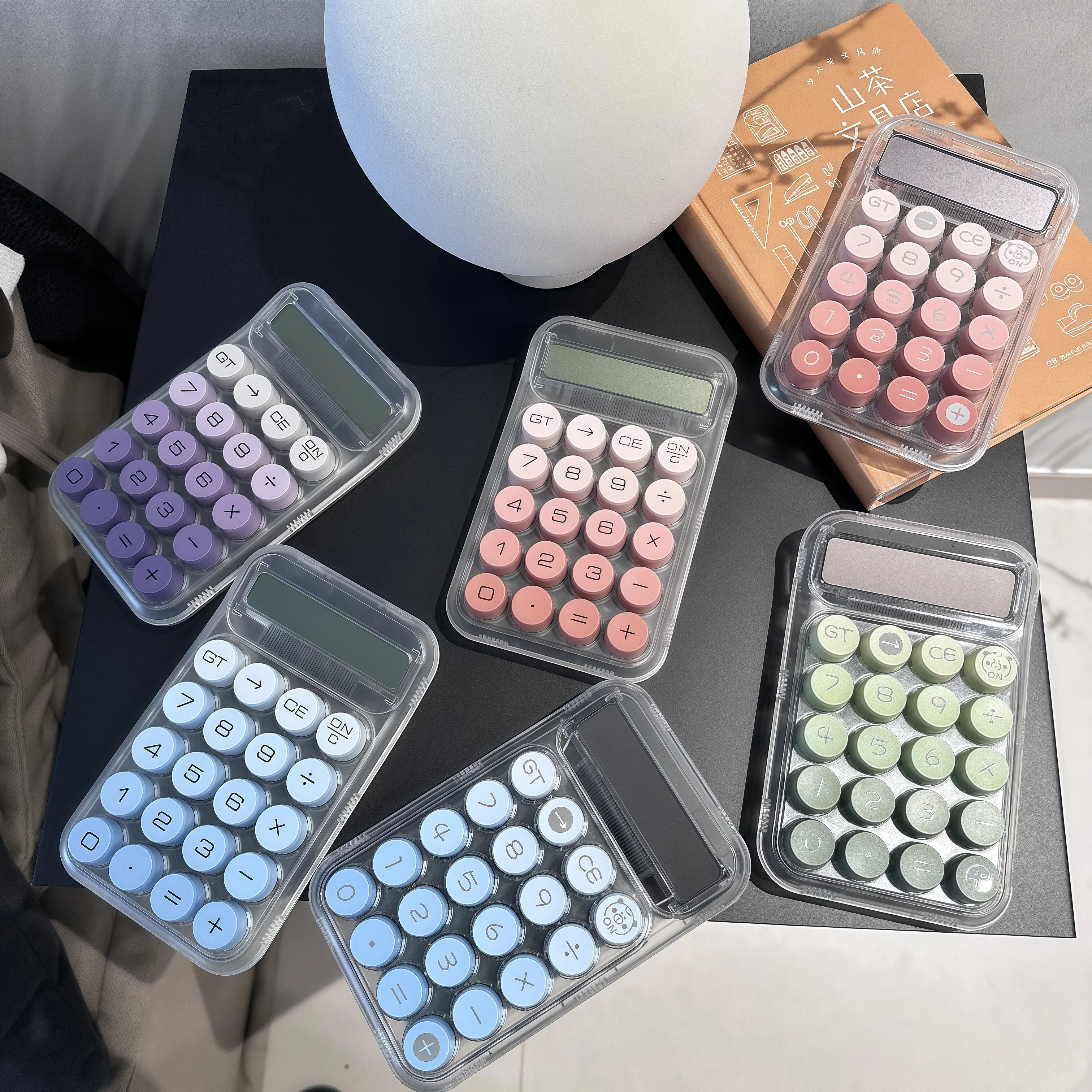 

1 transparent dopamine mechanical key calculator, 10-digit large screen, stylish feminine design.
