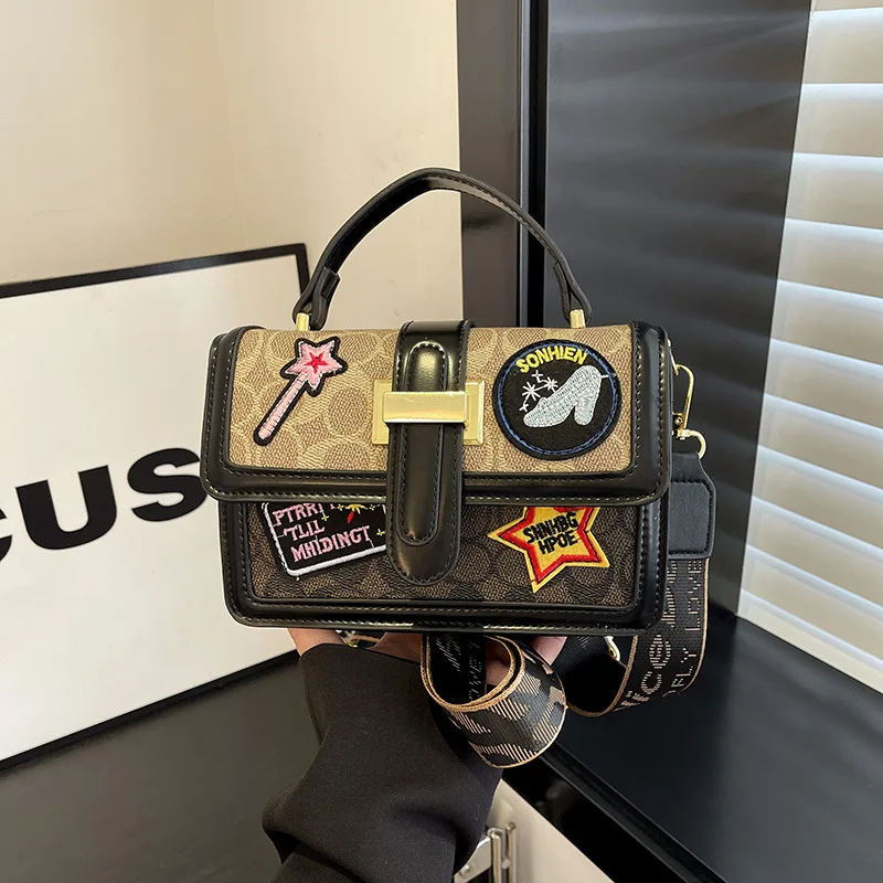 

2025 Women's Bag Oblique Cross Small Square Style, Badge Adornment, Casual & Versatile. Wide Shoulder Strap for Easy Portability