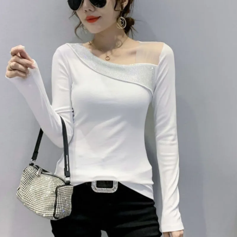 เสื้อสวมหัวแขนยาวแฟชั่นแบบใหม่ในฤดูใบไม้ร่วงแนวทแยงสำหรับผู้หญิงเสื้อเชิ้ตเรียบง่ายเสื้อลำลองอเนกประสงค์เสื้อยืดผู้หญิงตะวันตกสำหรับฤดูใบไม้ผลิ