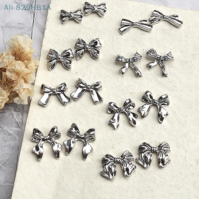 Metal Bowknot 3D Encantos das unhas, liga prateada Acessórios, Manicure Rhinestone, Jóias Diamante, Nail Art Salon Decorações, 10pcs