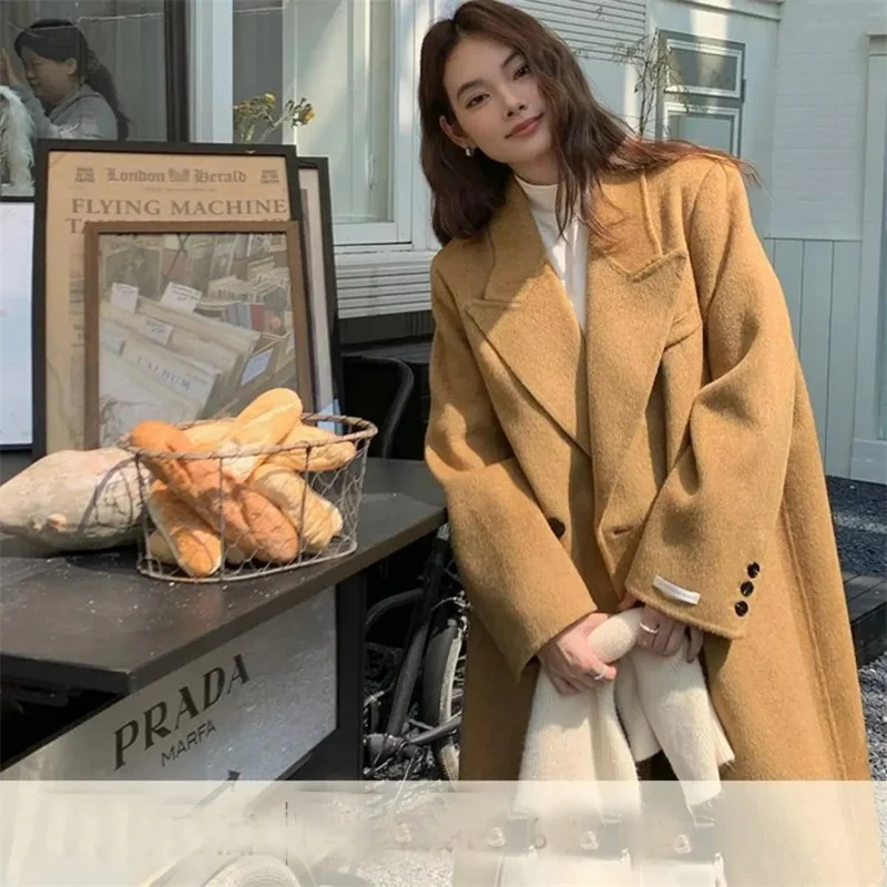 2026 Cappotto di lana con petto abbassato da donna autunno 2026 Moda stile sciolto Abbigliamento invernale da donna Cappotti lunghi Top