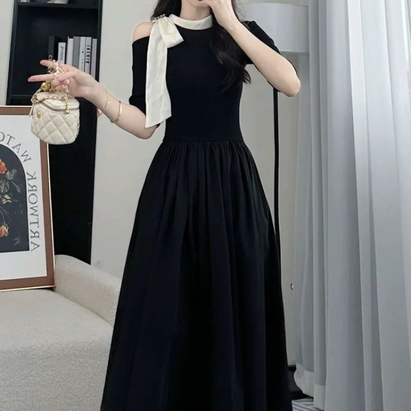 French bow black dress 2024 summer new fashion Joker loose off-the-shoulder waist temperament Hepburn style skirt