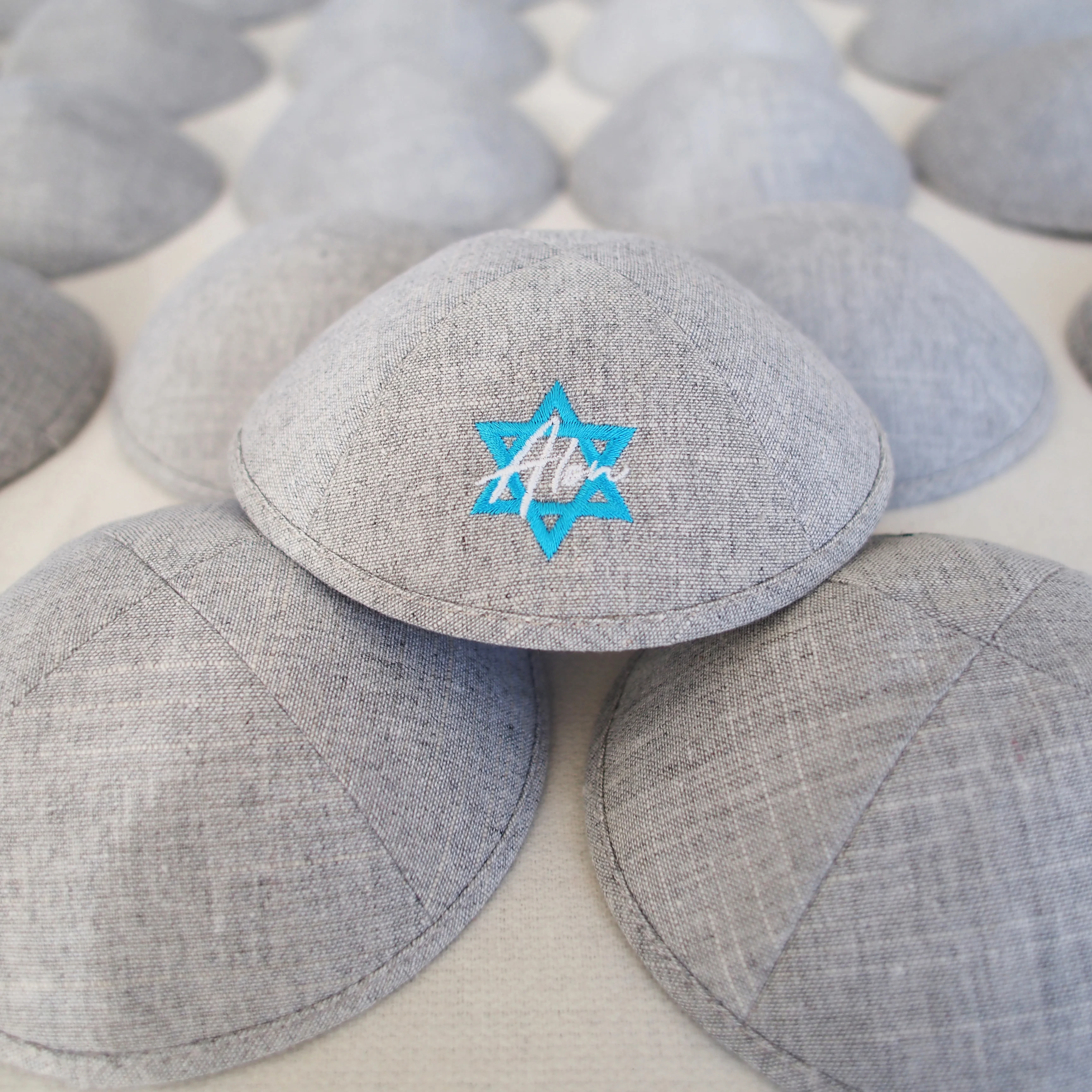 Kippot. Classic grey linen fabric. Custom embroidery and digital printing available, ideal for weddings or bar mitzvahs.