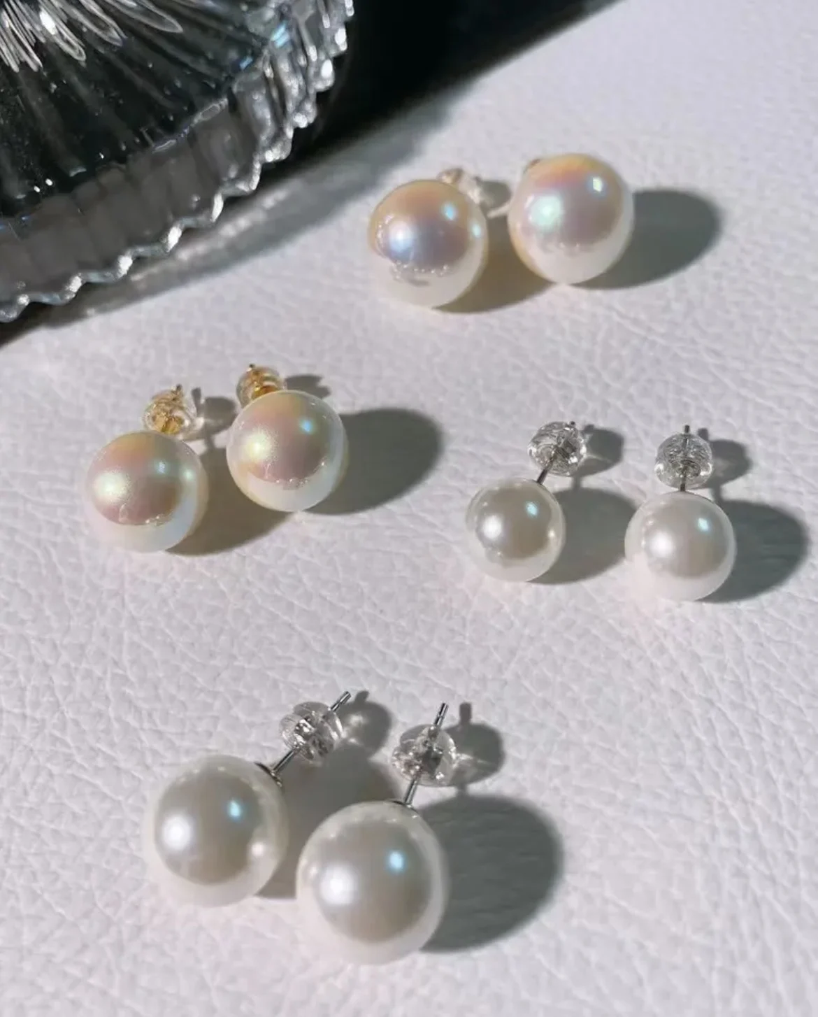 

Elegant pair of AAAA 10-11mm natural Japanese round white pearl earrings 925s
