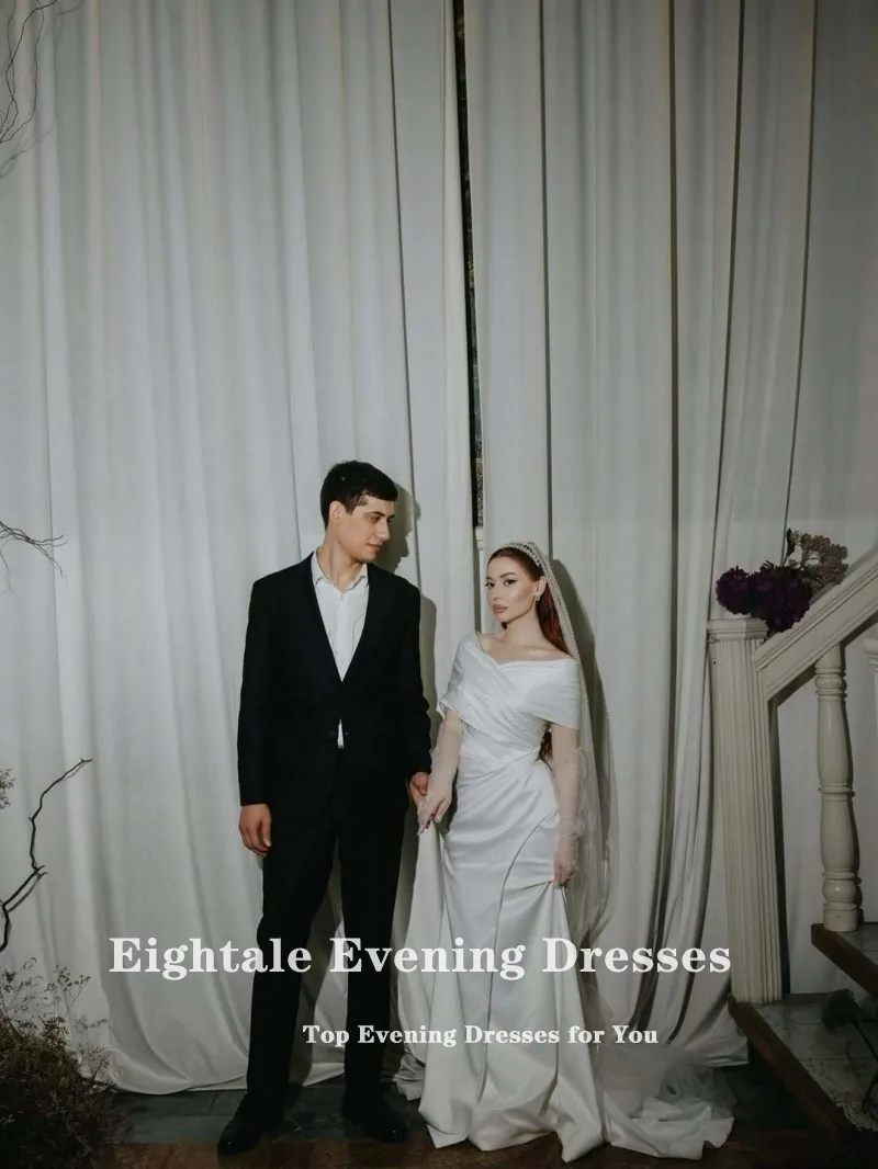 ชุดแต่งงานแบบอาหรับสีขาวงาช้าง ทรงเมอร์เมด ผ้าซาติน แบบเปิดไหล่ จีบระบาย  รับตัดตามสั่ง