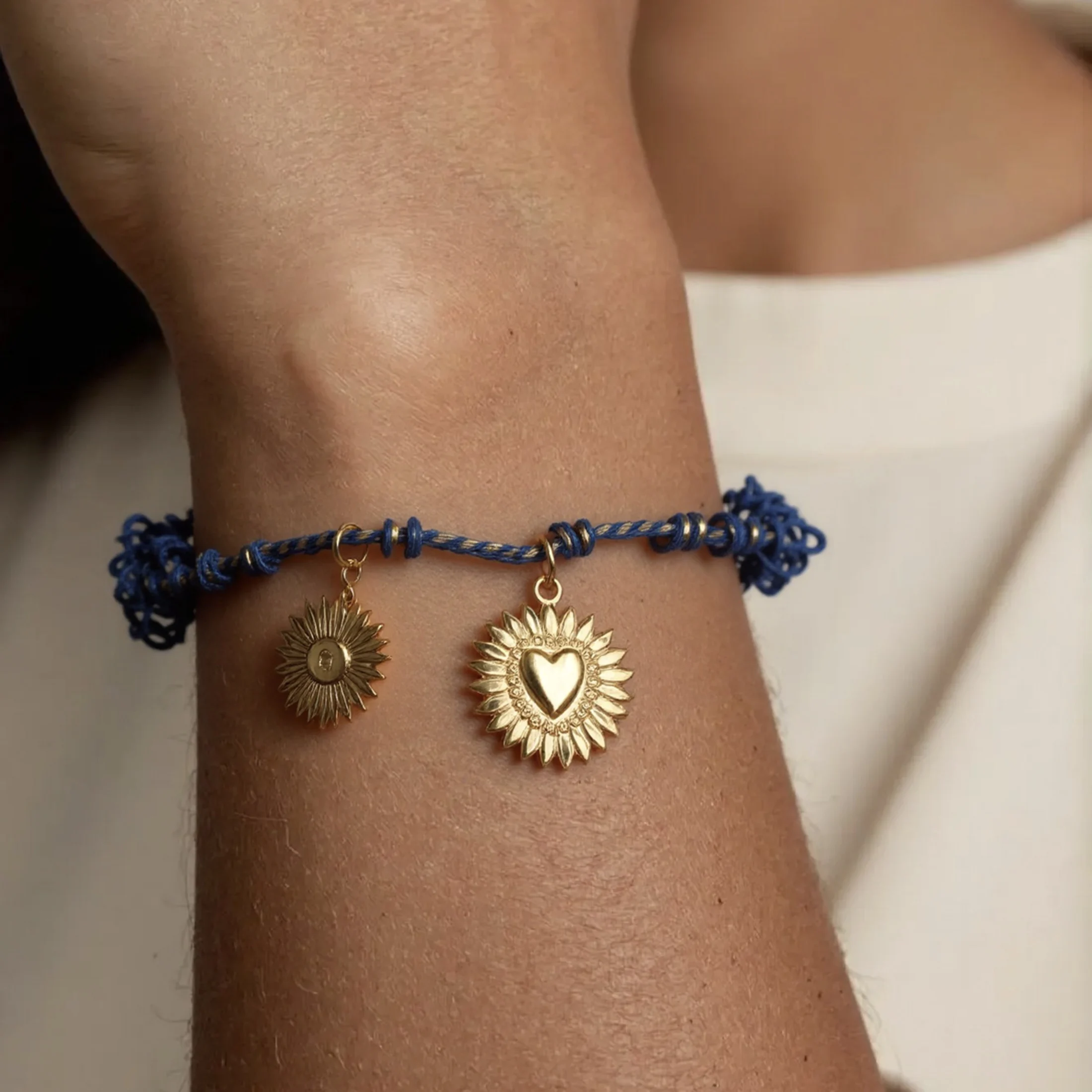 

Golden Tone Braided Cord Evil Eye and Sun Charm Bracelet for Women