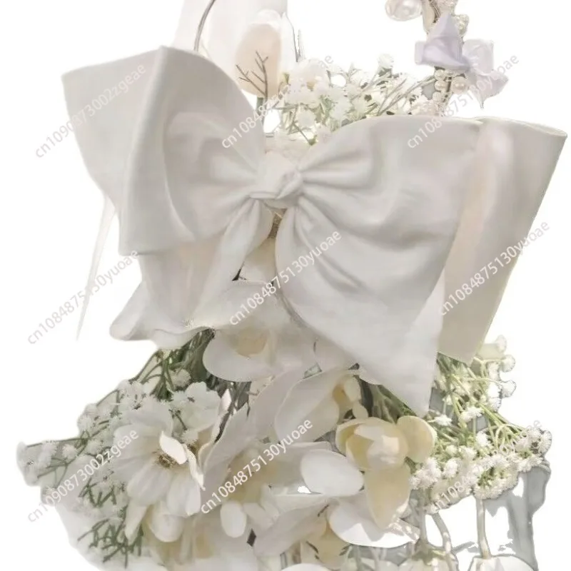 

bride holding simulated flower crescent bouquet calla lily tulip photography props wedding certificate follow-up bouquet