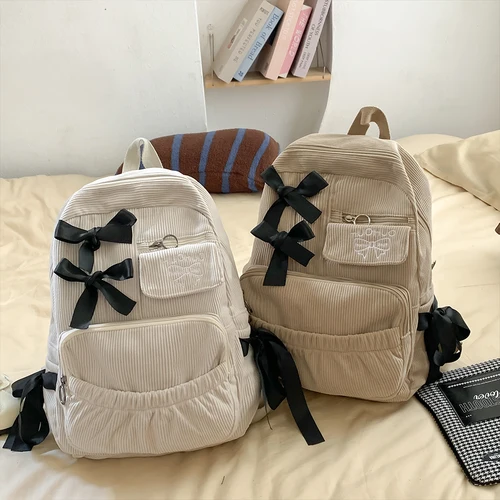 2025 Nueva mochila coreana Ins para ir al trabajo, mochila versátil para estudiantes universitarios, mochila de alta belleza, mochila con lazo