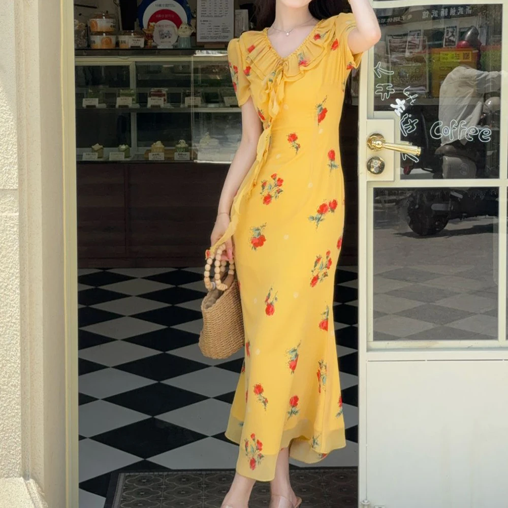 

French holiday style yellow floral chiffon dress women's 2026 summer new seaside temperament fishtail long skirt