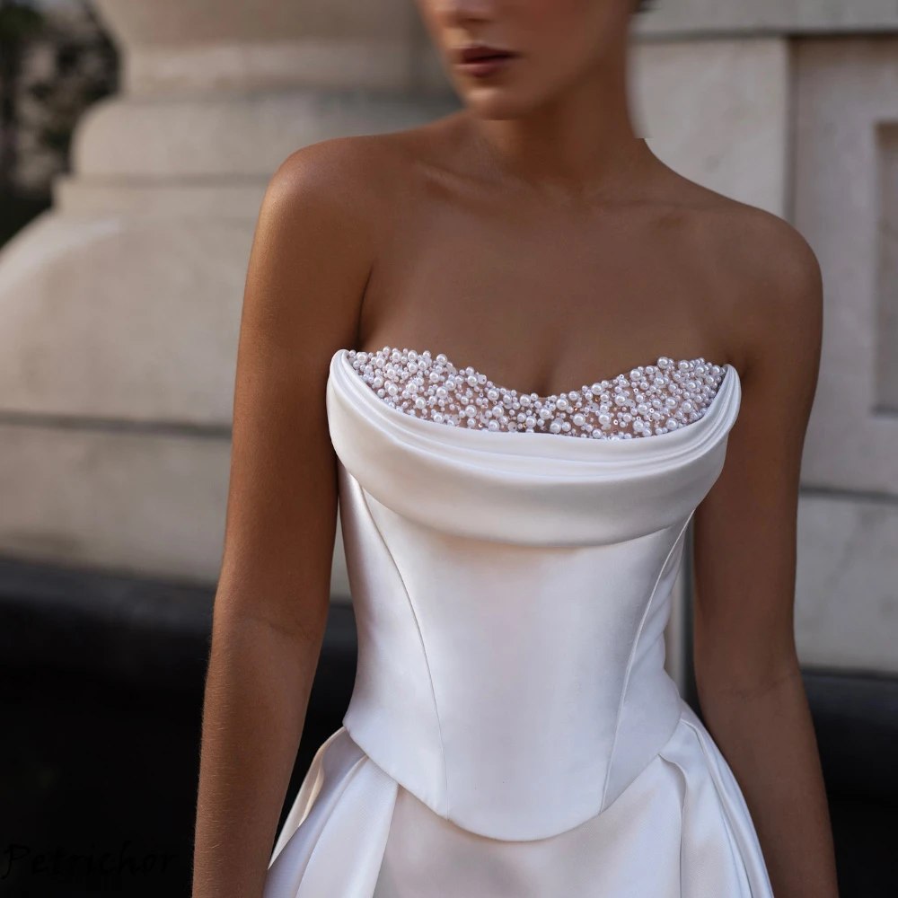 

Customized Pure White Satin Bridal Gowns Romantic Strapless Pearls A-Line 2025 Wedding Dresses Sparkly Sequined Robe de mariée