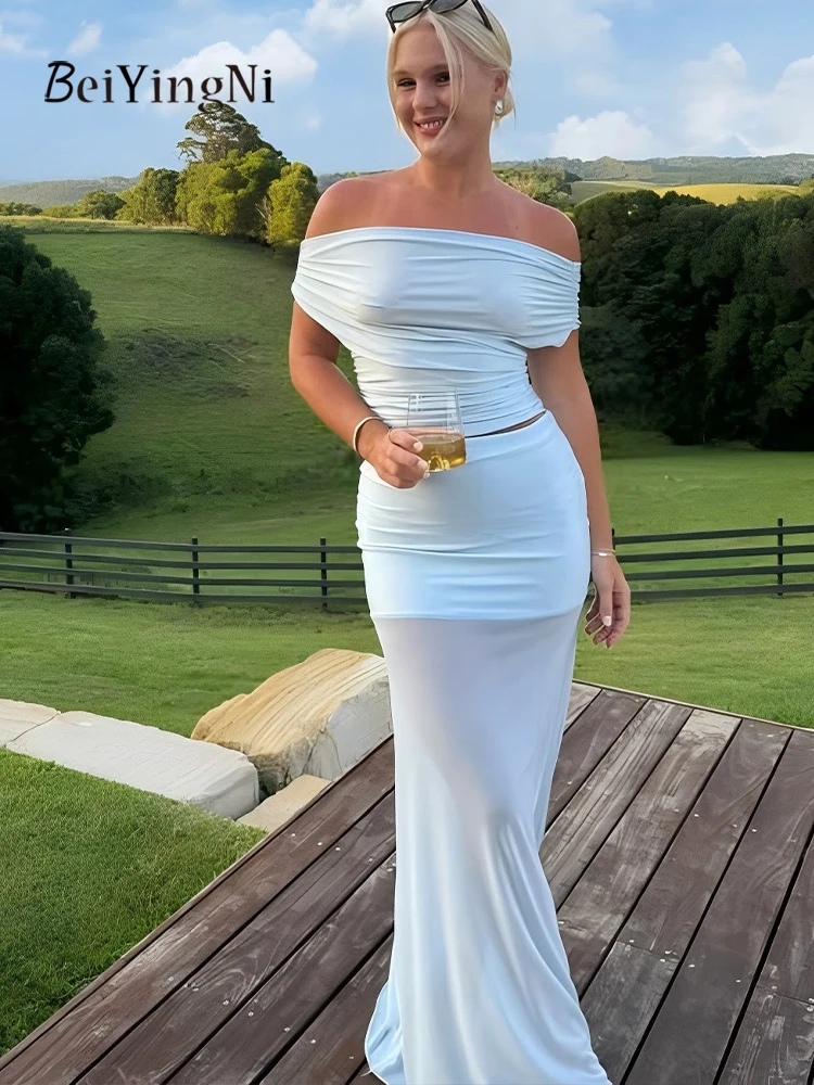 Beiyingni 2025 nueva moda mujer faldas conjuntos de 2 piezas Sexy flaco sin espalda Slash cuello camisetas chándales mujer negro azul conjunto