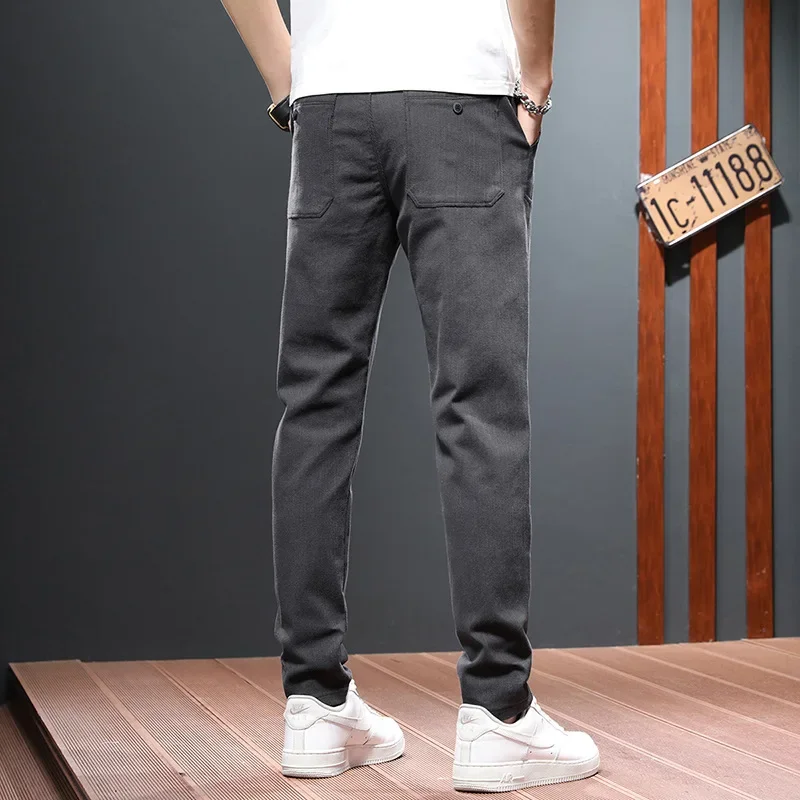 模造牛パンツ男性春と秋のトレンドストレートレッグパンツビジネスカジュアルパンツ男性成人紳士快適なルーズ