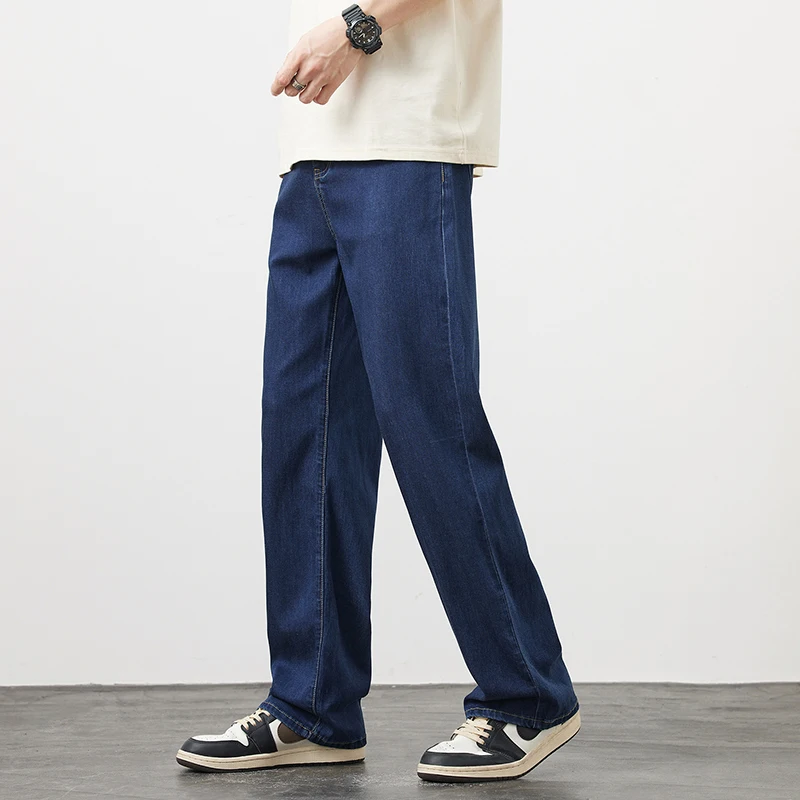 Letnie cienkie męskie Lyocell luźne proste dżinsy miękkie drapowanie lodowy jedwab Casual spodnie dżinsowe z szeroką nogawką moda koreańska moda uliczna