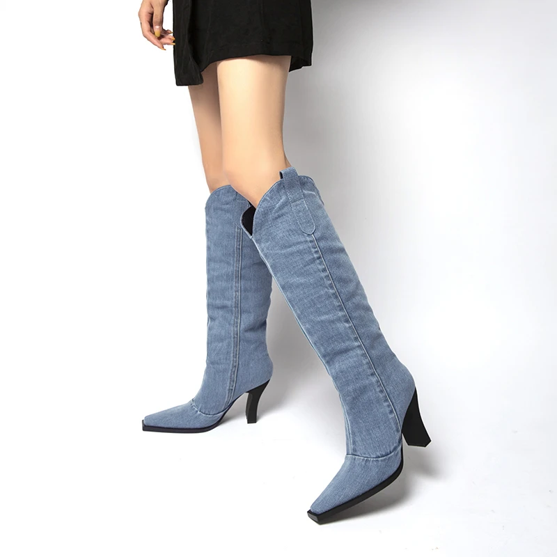 Casual thick heeled Western denim boots with a pointed toe that falls below the knee, oversized fashion boots