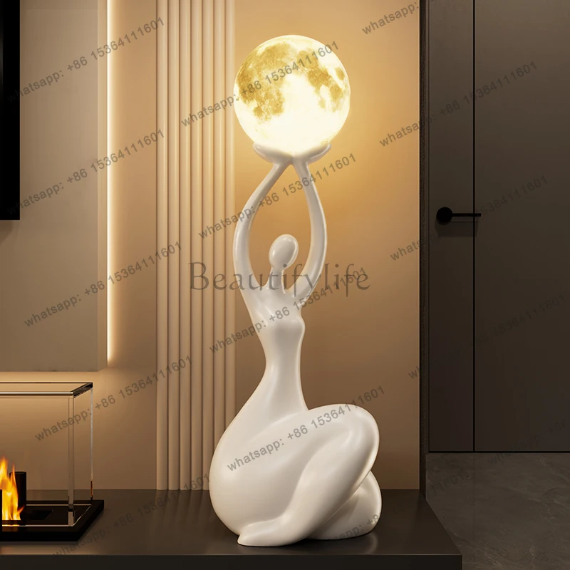 

Abstract figure art ornament, high-end sense, floor-to-ceiling ambient light decoration next to modern TV cabinet