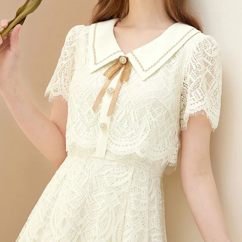 

Gentle wind lace dress female 2024 summer doll collar embroidery fresh solid color casual fashion temperament fake two skirts.