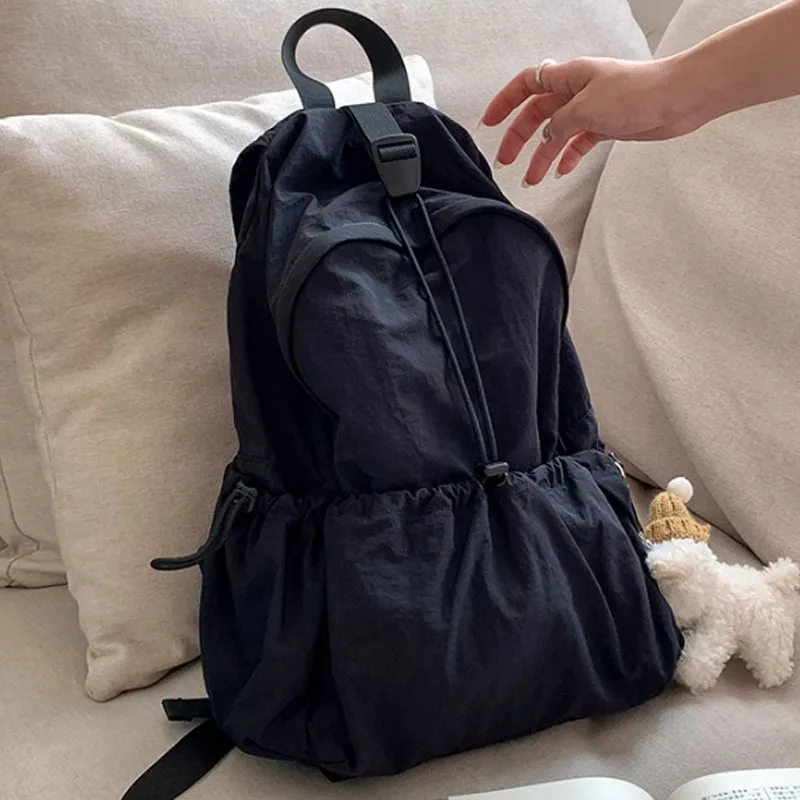 Large capacity women bag with multiple pockets and drawstring backpack new style for male and female students backpacks