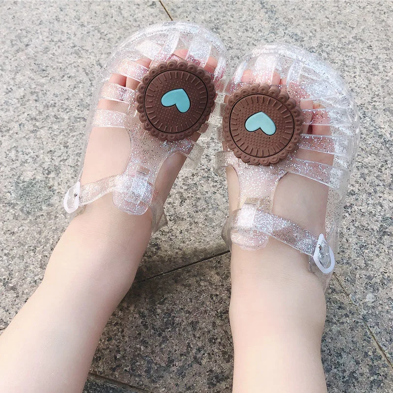 Korean version of the new summer boys and girls luminous jelly shoes smiley luminous soft bottom princess shoes beach shoes