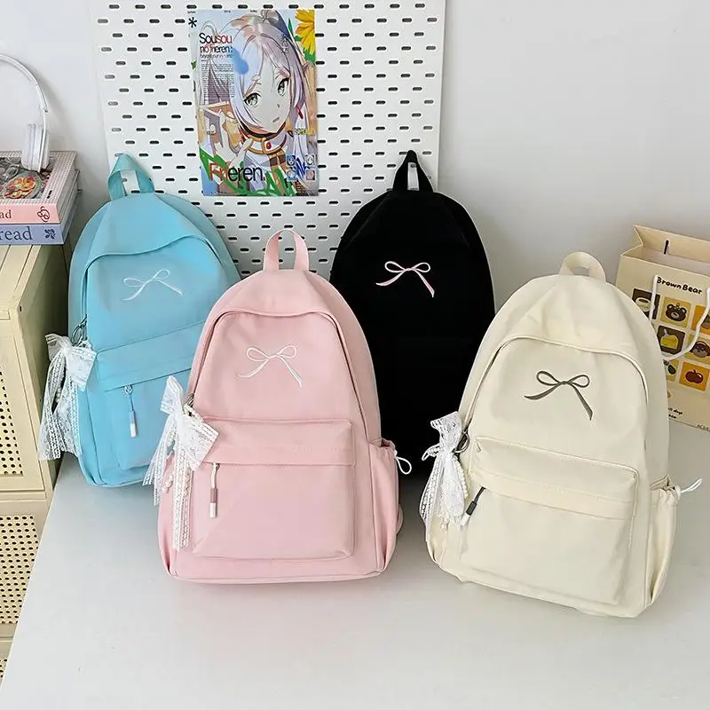 กระเป๋าเป้สะพายหลังสีพื้นน่ารักสไตล์เกาหลี ความจุเยอะ น้ำหนักเบา เหมาะสำหรับเดินทาง ปักลายโบว์  กระเป๋านักเรียน ของขวัญ