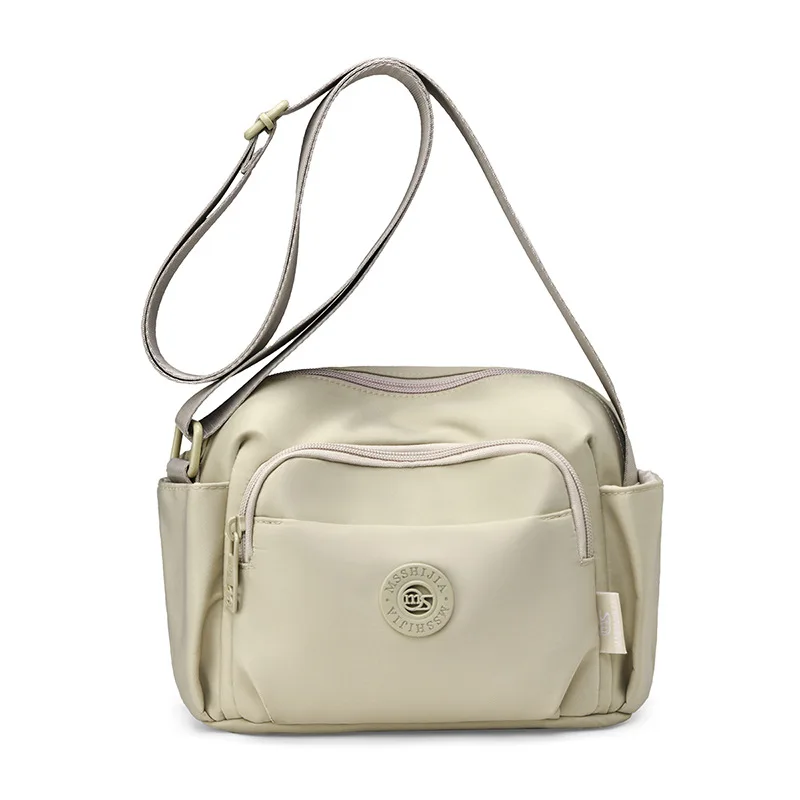 2026New multi-layer crossbody bag for women, suitable for business trips and travel, featuring multiple pockets, made of nylon f