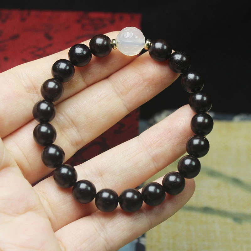 

Ebony 8mm bracelet with Ruyi jade accessories, unisex cultural prayer beads