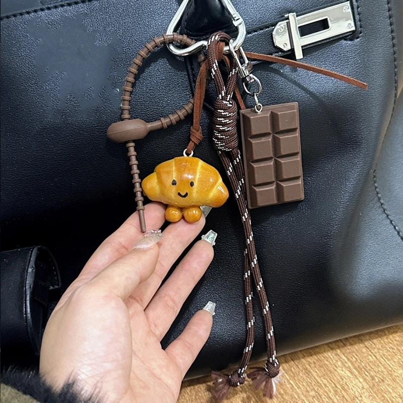 2026 New Lovely Exquisite Braided Rope Alkali Bread Braided Rope Bag Hang Chocolate Spring Buckle Pendant Senior Sense Pendant