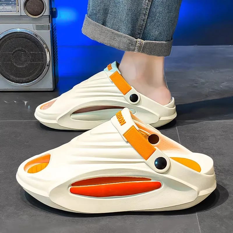 

Slippers men's 2026 summer wear non-slip driving dual-purpose men step on shit feeling seaside beach sandals lightweight