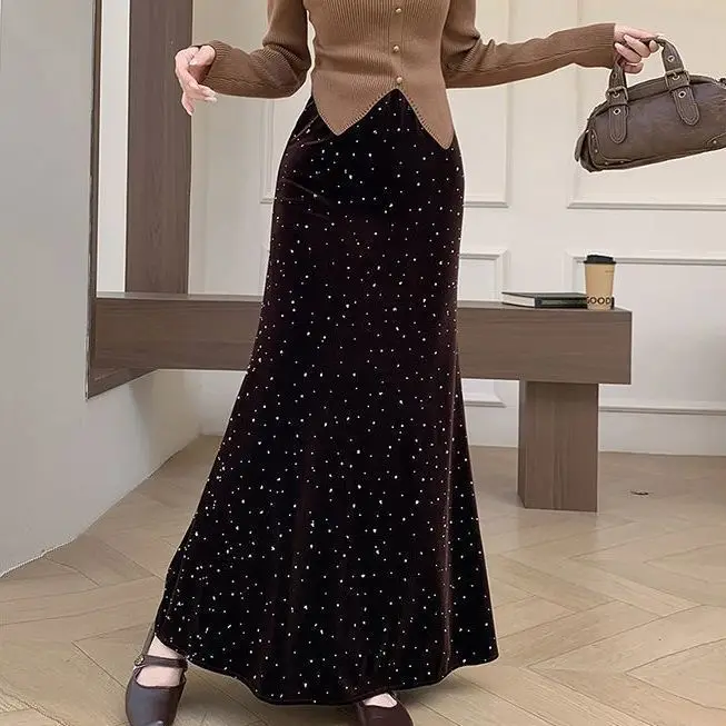 Golden velvet skirt autumn and winter 2025 new high-waisted A-shaped  thin hip  heavy industry hot diamond fishtail skirt