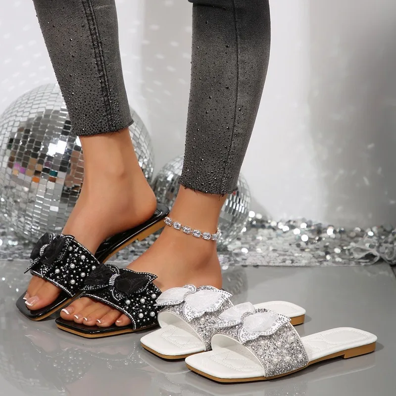 

Женские летние тапочки, новинка 2024, роскошный дизайн, женские модные сандалии с бантом и кристаллами, большие размеры, женские шлепанцы, обувь на плоской подошве