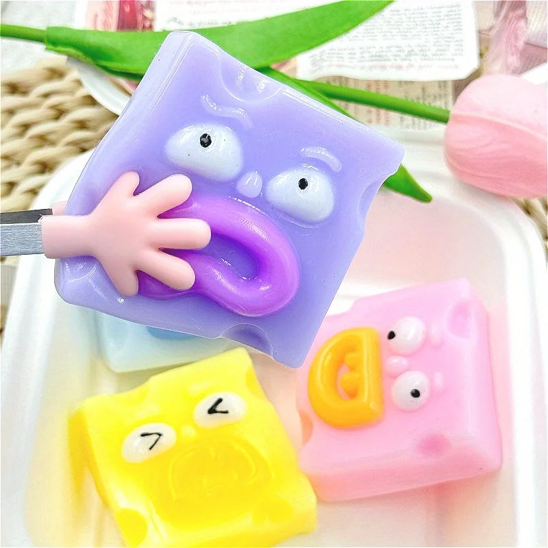 Giocattolo da spremere quadrato con bocca di salsiccia eccentrica - Giocattolo di scherzo antistress TPR in rosa, giallo, blu, verde con espressione facciale unica