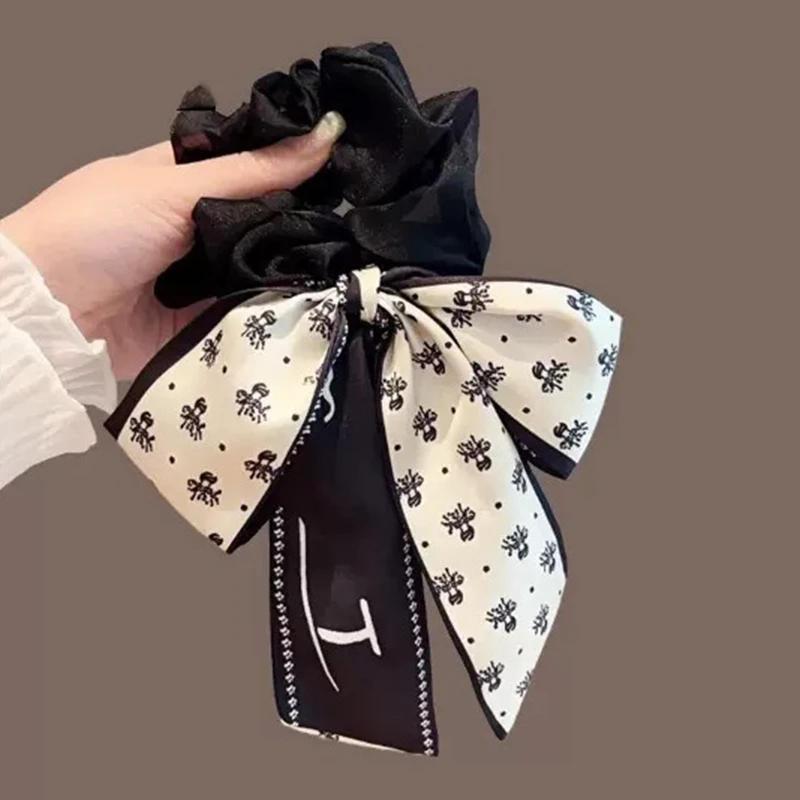 Elegante corda per capelli con fiocco stampato: fascia per coda di cavallo con nastro dolce, accessorio per capelli alla moda per le donne