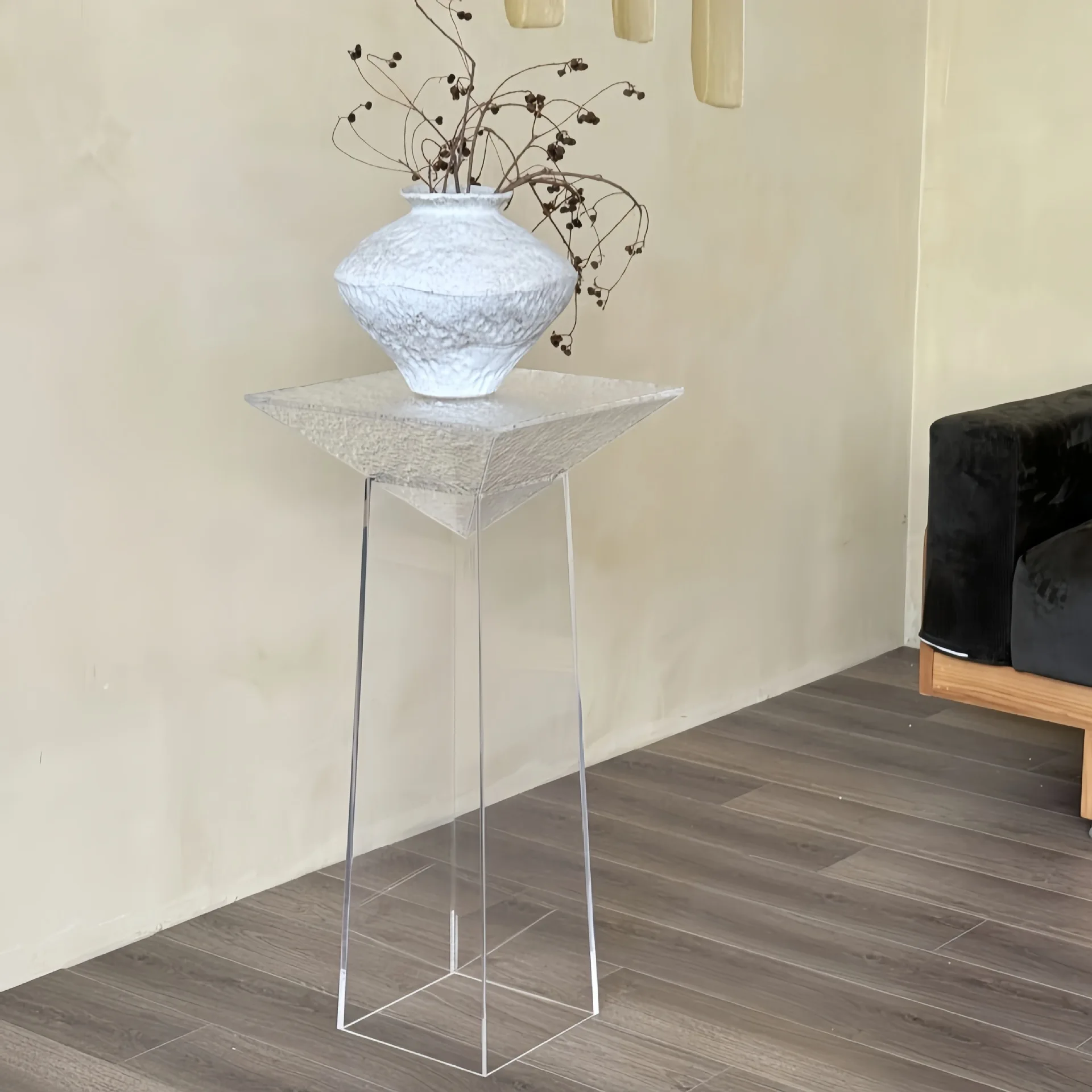 A few suspended shelves next to the sofa in the living room, decorative display flower pot rack
