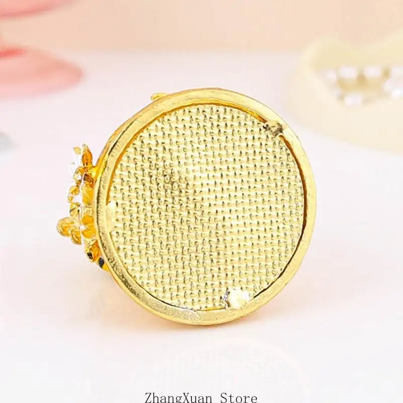 Decorative Hive-Form Small-Item Box with Warm Metallic Finish, Flower Decoration, and Closing Lid for Jewelry on a Dresser or