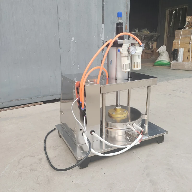 เครื่องทำแพนเค้กเครื่องขึ้นรูปเค้กแบบบางเครื่องรีดแป้งที่อบขนมข้าวสาลีแบบวงกลมเครื่องอัดความร้อน Tortilla roti